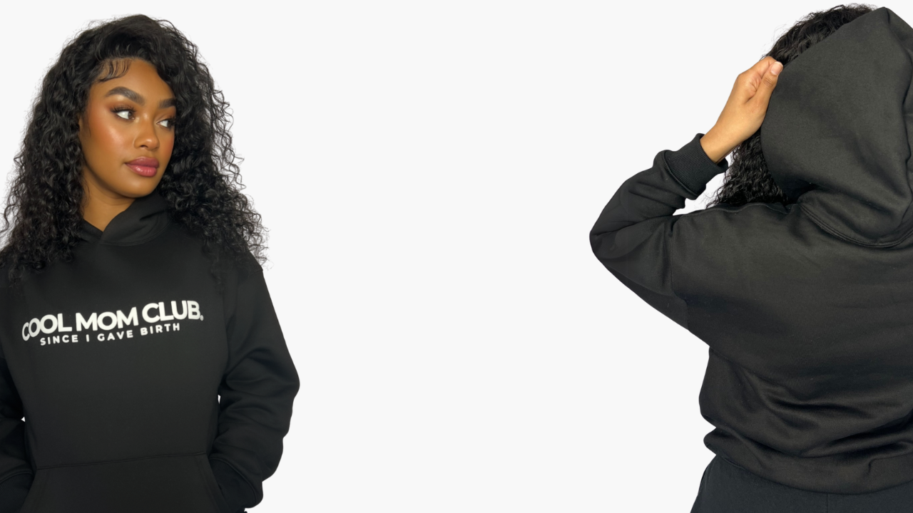 Woman wearing a COOL MOM CLUB black hoodie