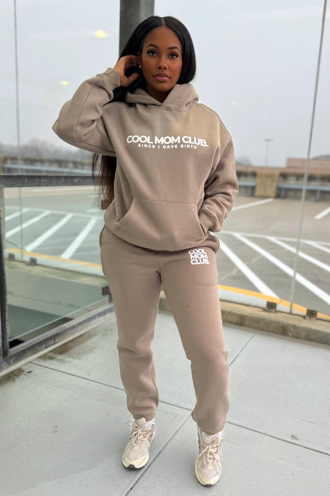 Cool Mom Club Set in Nude an Essential Sweatpants & Hoodie Set on a model